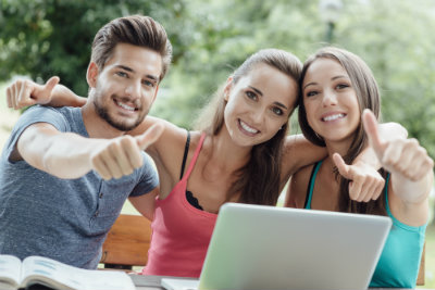 Three Young Adults with Computer