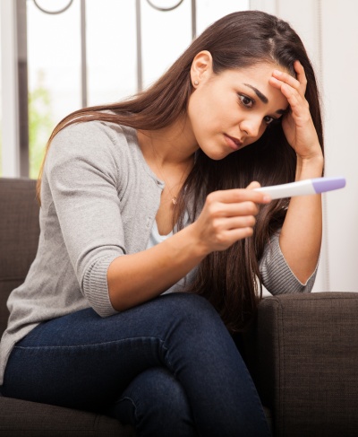 Young Woman with Pregnancy Test