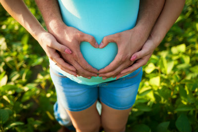 Hands Make Heart on Pregnant Belly