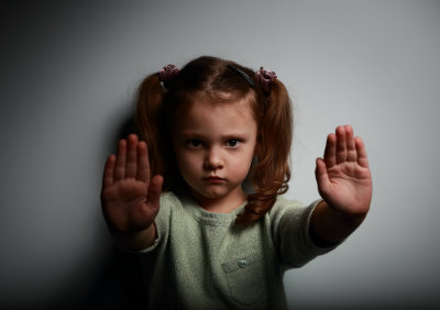 Child's Hands Up Against Abuse