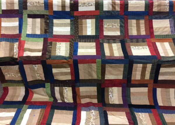 This twin-size quilt by Joyce Larsen will be the grand prize in a drawing held at the Holiday Shopping Open House.