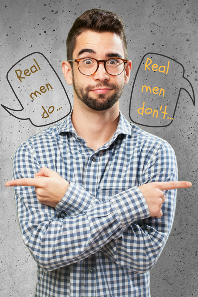 Guys get conflicting messages about what it takes to be a real man.