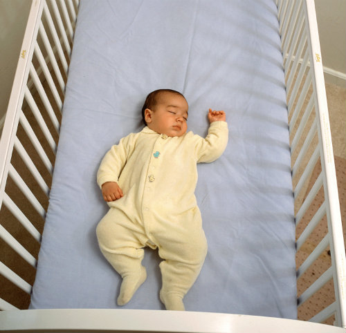 A safe sleep environment, such as this firm mattress with no loose blankets, toys, or padding, will help reduce the risk of SIDS.