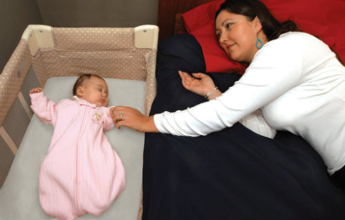 Share a room but not a bed with your baby to help reduce the risk of SIDS.