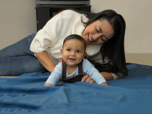 Give Baby plenty of Tummy Time while she's awake to reduce the risk of SIDS.
