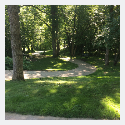 Shady trails at Alexander Ramsey Park make popular trips for families.