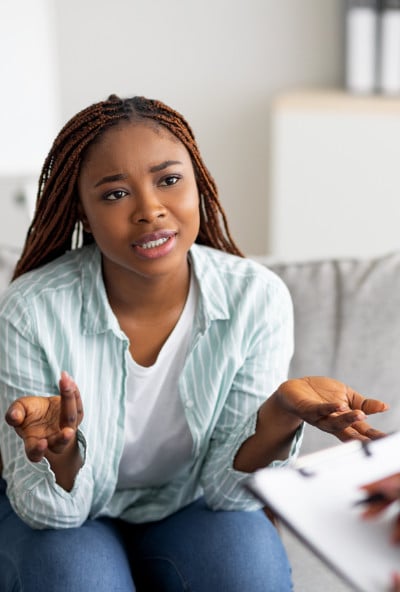 young black woman asking consultant for information