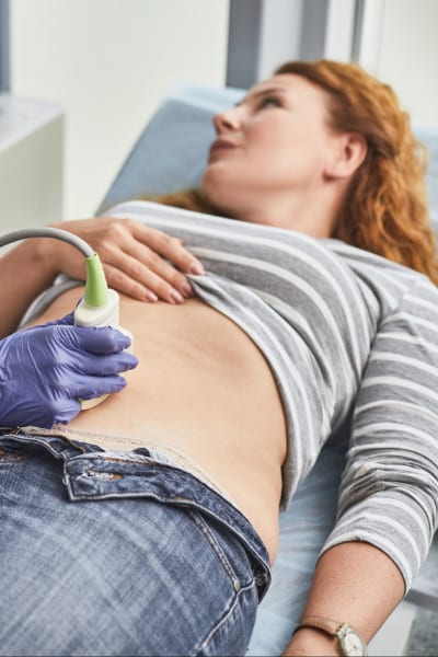red haired woman gets early pregnancy ultrasound red haired woman gets an ultrasound in early pregnancy