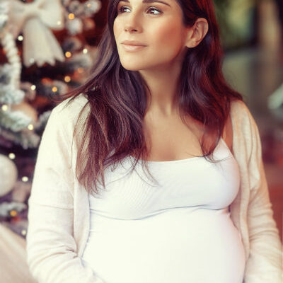Pregnant Mom By Christmas Tree