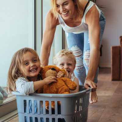 Mom Pushing Kids in Laundry Basket