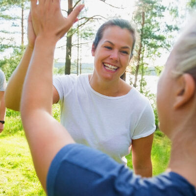 Woman Giving Each Other a High Five