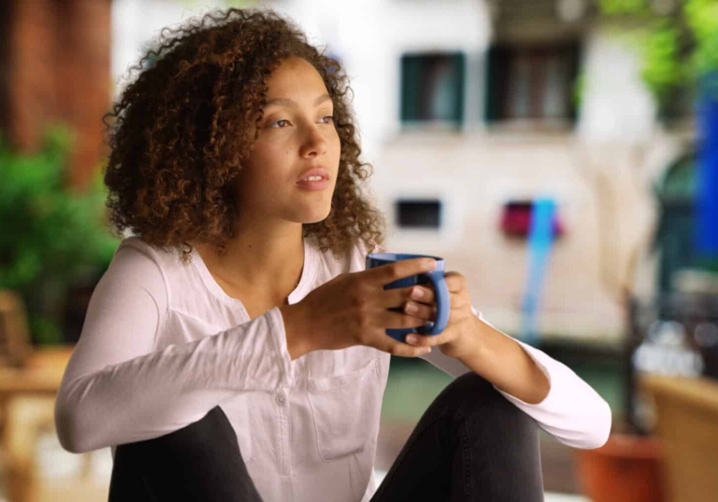 Woman Thinking Over Coffee