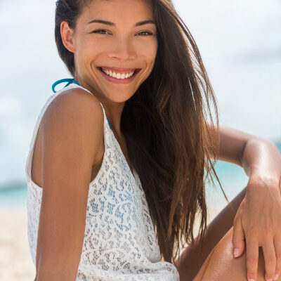 Smiling Health Woman on the Beach
