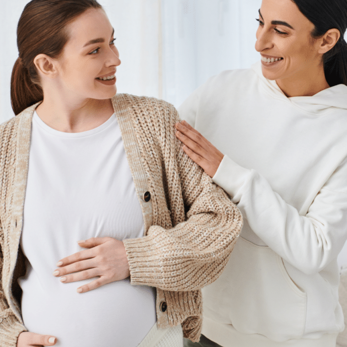 pregnant woman with support professional giving encouragement