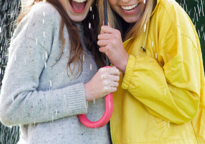 Teens Using Umbrella